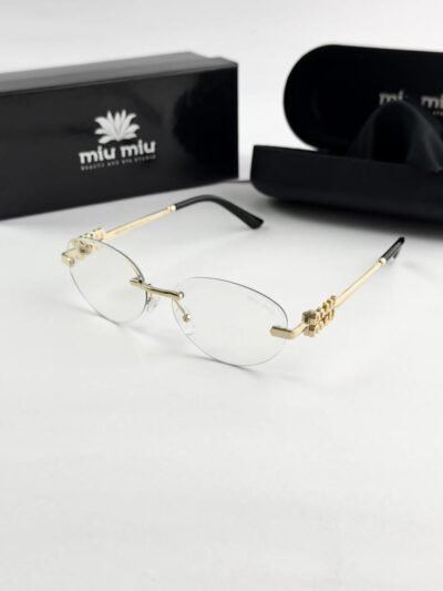 MIU MIU gold frame 1025